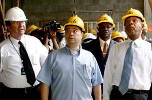 Shanghai Construction head, Michael Qing Zhang, centre, with former PM Patrick Manning, right, and Calder Hart of UDeCOTT touring NAPA under construction.