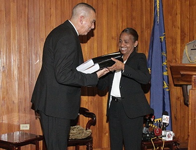 President Anthony Carmona receives the report of the commission of enquiry into Clico from secretary to the commission, Judith Gonzales, at the Office of the President, St Ann’s, yesterday. © 2016, T&T Guardian.